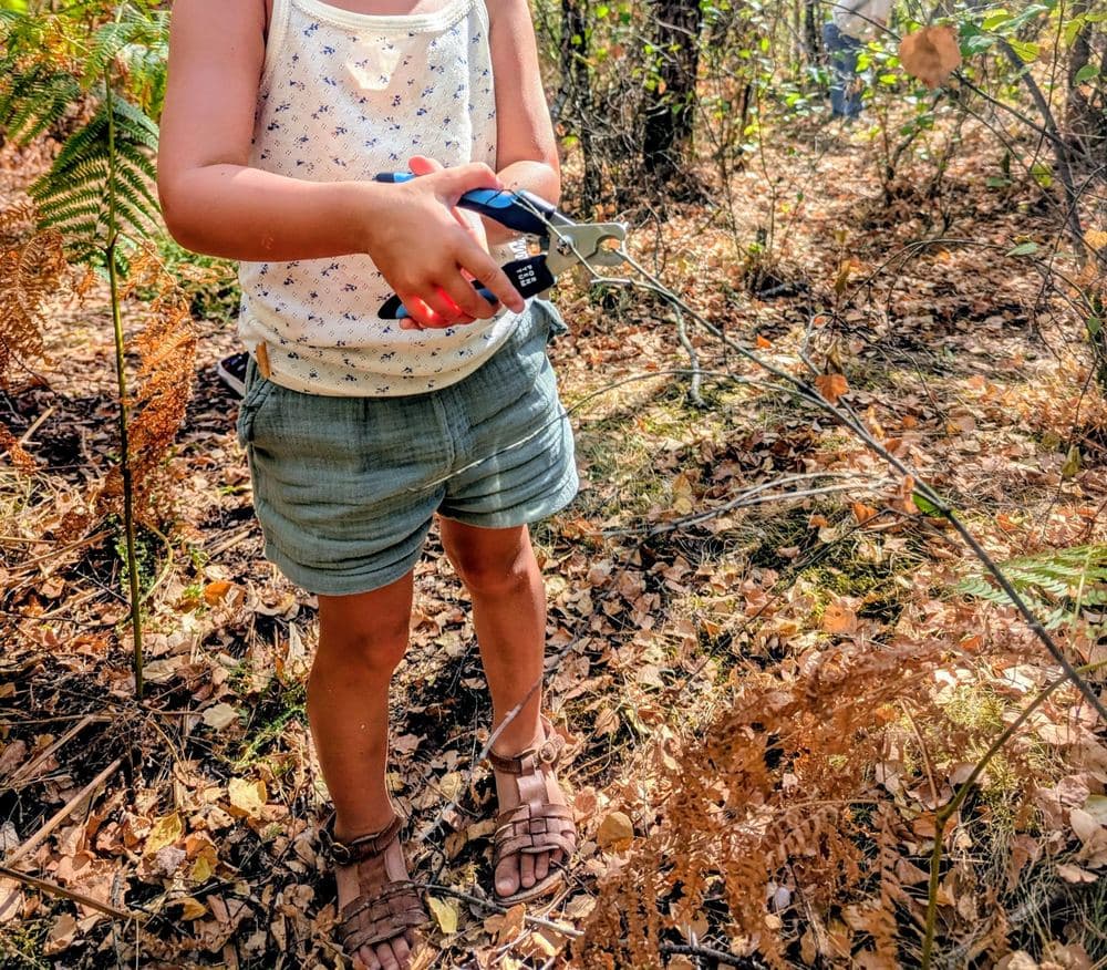 Child taking part in a Forest School activity in the garrigue